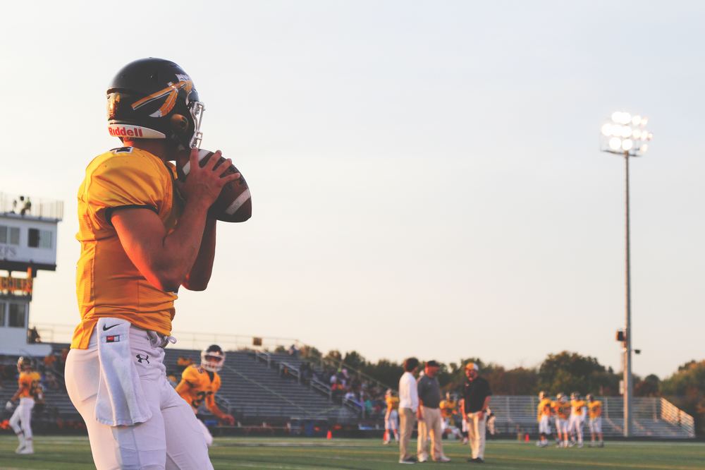 An image showing An american football player, college football drinking game, college drinking statistics 2019