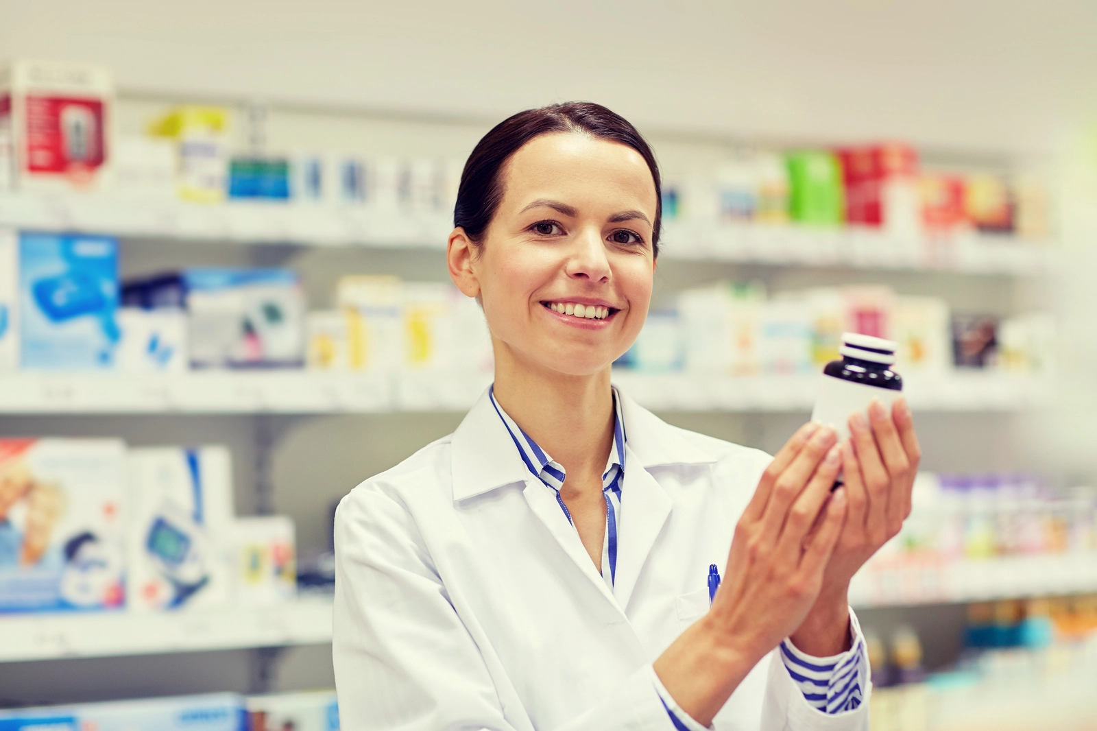 pharmacist with generic bottle of pills