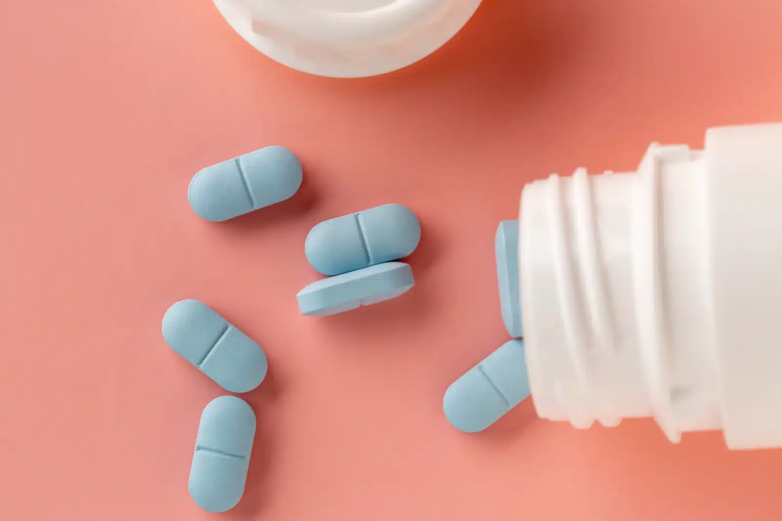 Blue pills spilled on table
